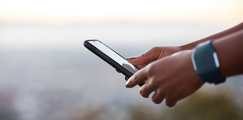 Image showing Runner hands, phone and smartwatch for fitness, health or heart rate at training in urban, metro or park. Closeup, smartphone or communication on web app, social media or reading for wellness on rest