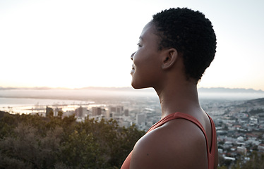 Image showing Black woman, fitness or city view in sunrise workout, training or exercise for healthcare wellness, cardiovascular strength or marathon. Happy smile, sports runner or sunset break on mountains road