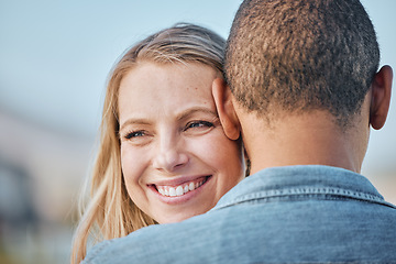 Image showing Couple, interracial with hug, love and travel, woman smile with black man, commitment and relationship with outdoor bonding. Face zoom, happy and romance in nature, trust and care with support.