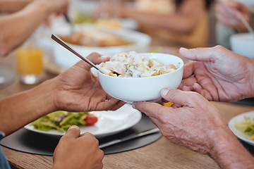Image showing Lunch, family celebration and hands with potato salad, party food and group eating at the dining room table. Nutrition, healthy food and friends hosting a home dinner with a salad for health