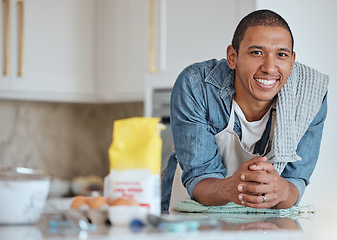 Image showing Happy man, face and smile while cooking in home kitchen with happiness and pride for chef or baker skills while at table for baking. Portrait of a dad in Brazil house to cook food for breakfast