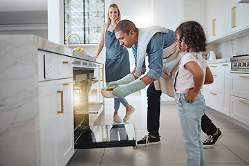 Image showing Family, oven and father cooking with girl and mother in kitchen preparing delicious meal. Food, learning or interracial couple, man and woman teaching kid while holding roast chicken for family lunch