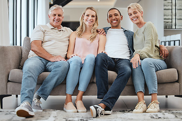 Image showing Big family, portrait and relax on sofa in home living room, smiling and bonding. Love, care and interracial couple, grandmother and grandfather sitting on couch, having fun and enjoying time together