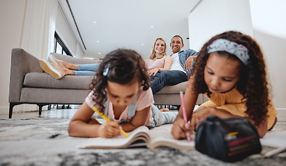 Image showing Wellness, relax and family with children drawing in coloring book in living room with happy parents. Interracial, mother and father on home sofa watching young kids draw and bond together.