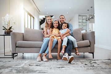 Image showing Portrait, love hug and family on sofa in living room, smiling and bonding. Care, support and happy mother, father and girls hugging, embrace or cuddle on couch, having fun and enjoying time together.