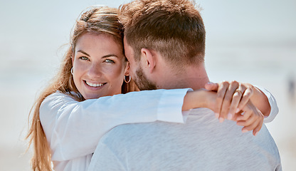 Image showing Love, couple and hug at beach portrait with smile for bond, trust and gratitude on holiday in Canada. Romance, care and joy of young people in happy relationship enjoying summer sunshine together.