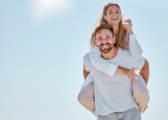 Image showing Couple, piggy back and happy on vacation in summer sunshine for romance, love and bonding outdoor. Man, woman and smile on travel, adventure or holiday for honeymoon, quality time and fun in Cancun