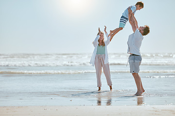 Image showing Family, beach and summer vacation with mother, father and child together for fun, love and care while together in water while playing. Man, woman and kid playing airplane game on sea holiday