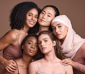 Image showing Diversity, beauty and portrait of a group of women in studio for skincare, makeup or cosmetic routine. Feminism, female empowerment and face of multicultural girl friends isolated by brown background