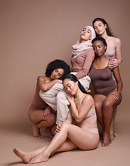 Image showing Diversity, woman and body positive skincare beauty for inclusion, spa dermatology wellness and natural body care in studio. Interracial model friends, support and relax cosmetic equality in underwear