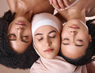 Image showing Diversity, woman and face, closed eyes for beauty, skincare wellness or cosmetics dermatology in studio. Natural makeup, facial care glow and interracial models relax, calm and peace for inclusion