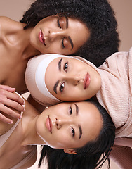Image showing Portrait, beauty and diversity with woman friends in studio on a brown background for skincare or inclusion. Face, pile and natural with a model female friend group posing to promote equality