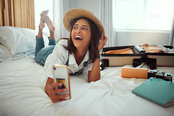 Image showing Travel, suitcase and phone with woman in bedroom of hotel for vacation, summer break and abroad trip. Online, internet and app with girl packing clothes for holiday, airbnb and schedule booking