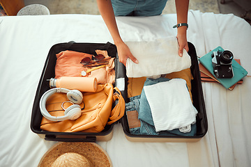 Image showing Travel packing, above and hands of a woman with clothes, holiday luggage and prepare for international summer. Suitcase, ready and person traveling with a suitcase, vacation clothing and hotel bag