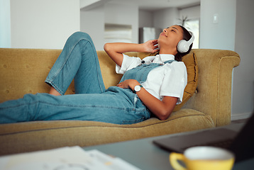 Image showing Young woman, headphones and relax with music at home, peace and calm with podcast or radio, audio streaming online. Freelancer on break, work from home and wellness with sound and listening.