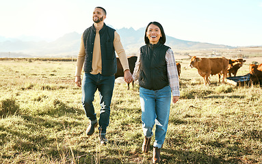 Image showing Couple, holding hands and farm in countryside travel, trip or adventure with live cattle together in nature. Happy man and woman smiling for relationship, traveling or freedom in natural agriculture