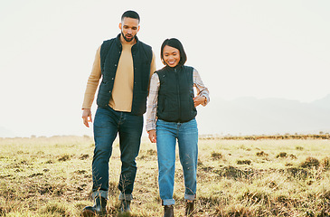 Image showing Farming couple, bonding or walking on nature field, sustainability agriculture environment or countryside land. Smile, happy or farmer man and woman talking and planning farm growth, success or ideas