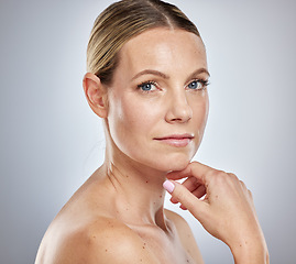 Image showing Health, beauty and natural portrait of woman with clean, hydrated and glowing skin aesthetic. Dermatology, skincare and confident cosmetic model feeling beautiful face in gray studio.