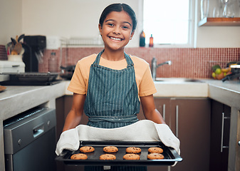 Image showing Baking, cookies and girl portrait happy about food, learning and youth helping in the kitchen and home. Cooking, house and child baker with a proud smile and happiness from making a kid dessert