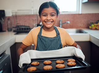 Image showing Girl kid, cookies and baking with portrait and bakery skill, learning and development with success and pride. Cookie, dessert and proud child baker cooking in kitchen with achievement and happiness.