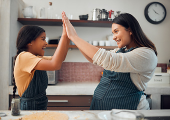 Image showing Cooking, high five and success with mother and girl in kitchen for cookies, bonding and pregnancy. Help, happiness and achievement with pregnant woman baking with daughter for support, food and goal