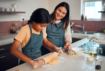Image showing Mom, girl and kitchen for teaching, rolling pin or cookies for baking, bonding love and family home. Mama, daughter and cooking for learning support, holiday or celebration for festive party in house