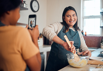 Image showing Baking, tutorial and social media with a chef woman in the kitchen of her home cooking as an influencer. Food, phone and vlog with a female cook preparing baked goods while live streaming in a house