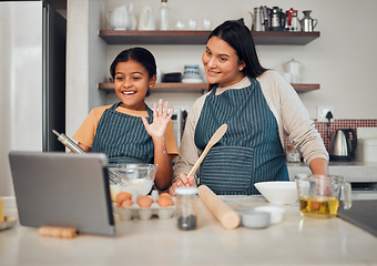 Image showing Family, baking and tablet while child wave hello at video call, food blog or zoom with mother and daughter in home kitchen. Content creator or influencer woman and girl teaching cake recipe online
