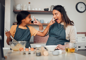 Image showing Baking, family and children with a mother and daughter learning hot to bake while being playful in the kitchen. Fun, kids and food with a girl and woman teaching a female child about cooking together