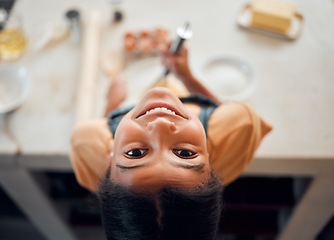 Image showing Cooking, kitchen and face portrait of kid baking dessert, food or prepare ingredients, egg or recipe. Youth child development, top view and happy African girl learning to bake cake, cookie or cupcake