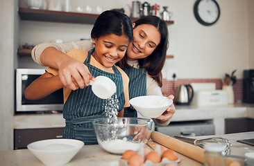 Image showing Family, baking and helping with food in home kitchen with mother and daughter learning to make dessert with wheat flour and eggs. Happy woman teaching girl kid about cooking for fun bonding