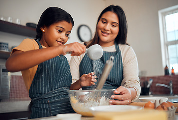 Image showing Help, learning and cooking food with mother in kitchen for lesson, independence and bonding moment. Focus, teaching and mom helping child with baker recipe at happy family home in Mexico.