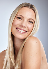 Image showing Face portrait, skincare and makeup of woman in studio isolated on a gray background. Natural beauty, aesthetics and cosmetics of female model with long blonde hair after salon treatment for growth.