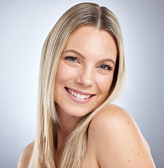 Image showing Portrait, hair care and woman with cosmetics, smile and organic products on grey studio background. Female, lady and head for soft, smooth and clean hair for confidence, treatment and natural beauty.