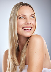 Image showing Face, beauty skincare and hair care of woman in studio isolated on a gray background. Makeup, cosmetics and aesthetics of happy female model thinking about salon treatment for hair growth and texture