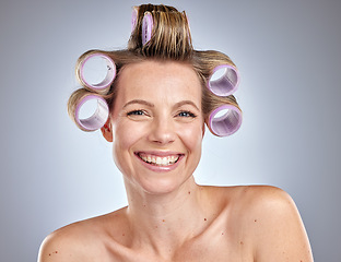 Image showing Face, hair care and woman with hair roller in studio isolated on gray background. Beauty portrait, makeup and cosmetics of happy female model with salon hair treatment or curler product for hairstyle