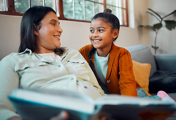 Image showing Education, book and pregnant woman with daughter for reading, morning relax and happy on the sofa. Learning, knowledge and mother with a child for a story during pregnancy for peace on the couch