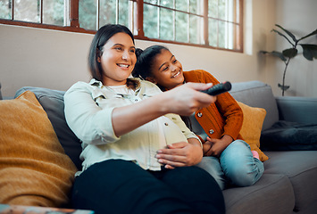 Image showing Relax, pregnant woman and girl watching tv, film or movies on sofa with remote control for a fun television. Happy family, pregnancy or mother streaming or enjoying entertainment with child at home