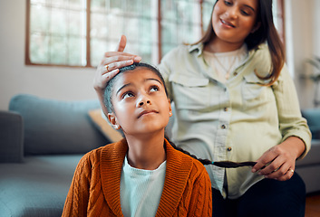 Image showing Hair care, grooming and pregnant woman with a child for love, care and thinking in the living room. Hair styling, happy and mother with a girl kid for braiding of hair during pregnancy leave