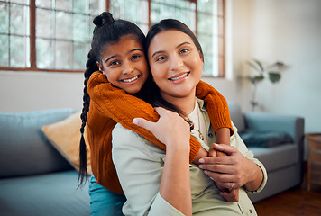 Image showing Pregnancy, hug and child with mother, love and peace in the living room of their home. Affection, happy family and portrait of a pregnant woman with a girl kid hugging during maternity leave