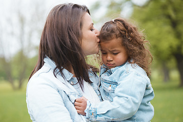 Image showing Love, park and mother kiss child with upset, sad and unhappy expression on face for leaving playground. Family, support and mom kissing young girl for compassion, comfort and console her in nature