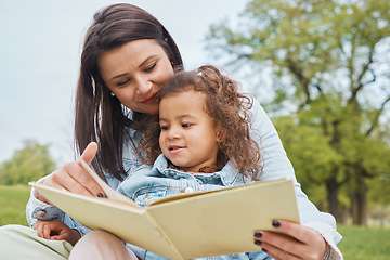 Image showing Mother, girl book and reading in park for storytelling, development and relax for bonding together. Mom, female child and learning with story, education or love in garden, nature or backyard in Miami