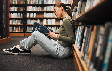 Image showing Book, reading and library student on floor with learning, education and research for school, university or college with inspiration. Bookshelf, Bible study history and a woman on ground reading book