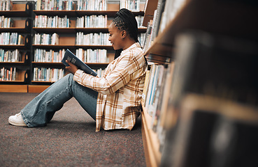 Image showing Bookshelf, library book and black woman reading, learning education and search knowledge at a university, college or campus. African student on floor reading book studying for exam or English project