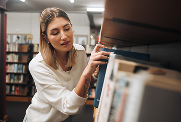 Image showing Girl, student and search books in library for education, knowledge and learning. Young woman, university student and bookshelf at college campus for reading, studying and literature research analysis