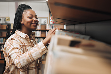 Image showing Student, checking or library bookshelf on school, college or university campus for education, learning or studying. Smile, happy or excited black woman in textbook search, research or retail shopping