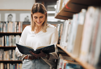 Image showing Happy, reading or student in library for books, educational knowledge or research for learning or assessment. School girl, college or university student studying for insight or scholarship on campus