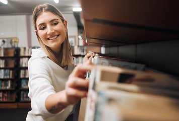 Image showing Library books, student and woman packing textbook in a education, university and learning book shop. School, college and happy graduate looking for knowledge, studying and learning with a smile