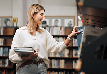 Image showing Girl, student and search books in library for education, knowledge and learning. Happy young woman at university, college and bookshelf for reading, studying at campus and doing research for project