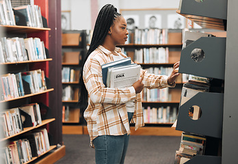 Image showing Books, education or black woman in a library to search for knowledge by bookshelf on a school or college campus. Focused, studying or university student learning for a scholarship or better future